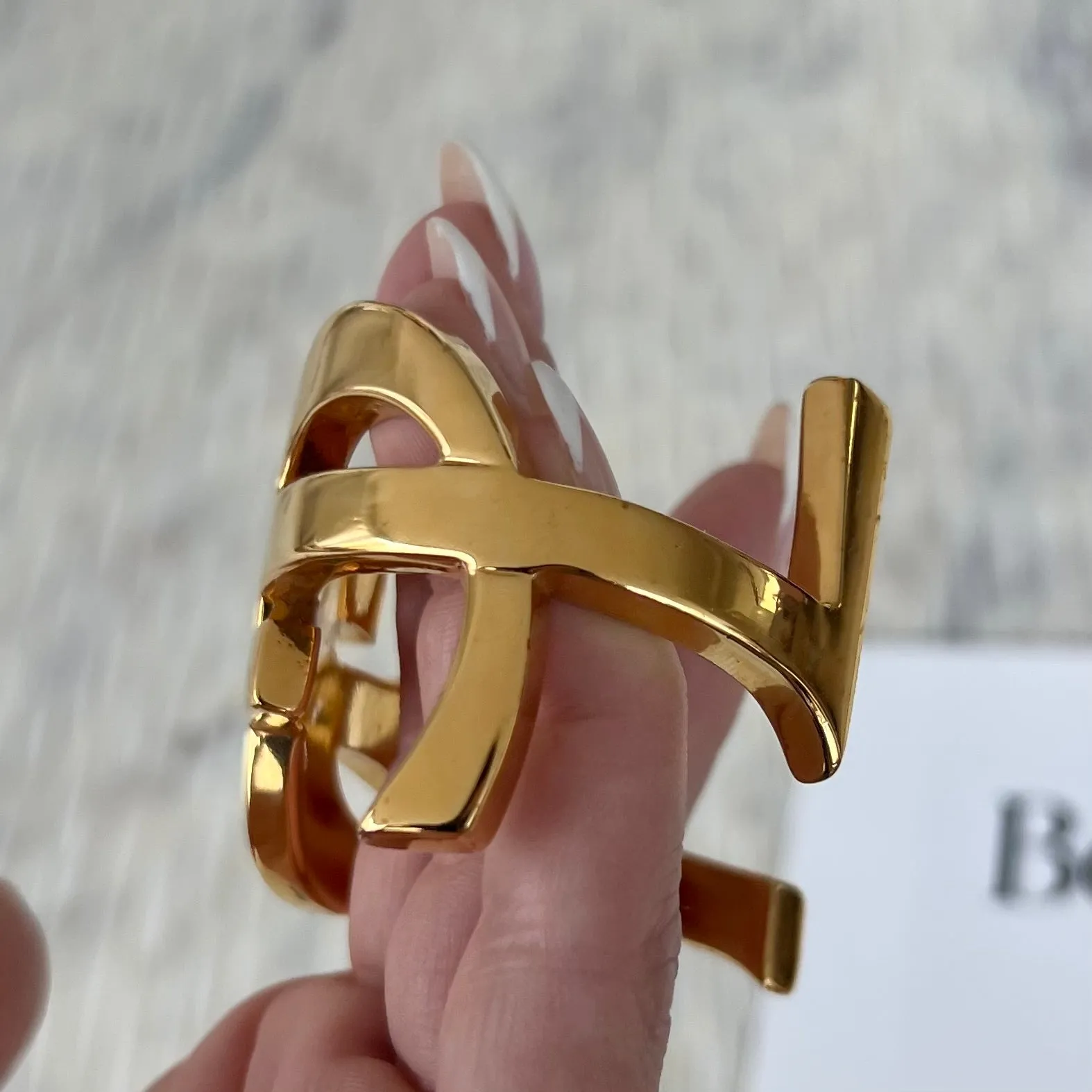 Saint Laurent Opyum Twist Bracelet Cuff In Gold Tone Metal